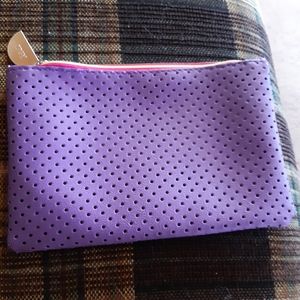 Ipsy Bag with four items